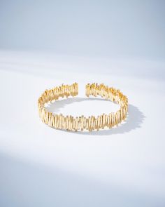 Indulge in luxury with this stunning gold cuff. Each individual piece of gold is meticulously strung onto an 18K spring gold wire, creating a strong and flexible bangle that effortlessly slips on and off your wrist. A true masterpiece of craftsmanship, this bracelet is both durable and comfortable to wear all day long. Elevate any look with this unique and timeless piece. Details 18k yellow gold 12mm width Ref: AKB144 Porcelain Tray, Gold Cuffs, Gold Bangle, Jewelry Tray, Diamond Gold, Classic Gold, Gold Wire, Harrods, Timeless Pieces