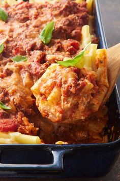 a casserole dish filled with meat and cheese