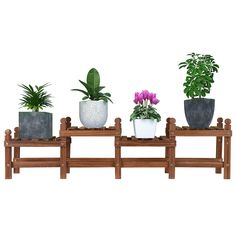 three planters are sitting on top of a wooden shelf with plants in them and one is purple