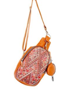 Handcrafted with quality full-grain leather, this crossbody sling bag features a zip-top closure and an interior pocket to keep your everyday essentials secure yet accessible and a small coin purse attached. This bag can be worn across the body (sling) or as a mini backpack. The interior of the bag is lined with beautiful, newly handwoven artisan fabric. Artisan embroidered up-cycle fabric in the outside, making every bag unique. Every bay is one-of-a-kind and slow-crafted by leather artisans in Travel Crossbody Chest Bag With Detachable Strap, Versatile Brown Crossbody Chest Bag, Brown Crossbody Saddle Bag With Zipper, Camel Shoulder Bag With Zipper Closure, Brown Crossbody Chest Bag With Detachable Strap, Camel Crossbody Shoulder Bag For On-the-go, Travel Shoulder Bag With Adjustable Strap In Camel, Camel Crossbody Satchel For Travel, Camel Shoulder Bag With Zipper For Everyday Use