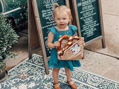 Penelope is all smiles with her first pretzel from belle’s! Pretty sure it doesn’t get any cuter than this! 🥨 All Smiles