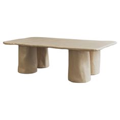 a white table with three pillars on it's legs and one leg raised up to the