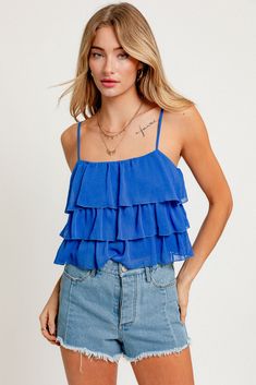 Get ready to layer up in style with the Jessica cami top! Made from 100% polyester, this cami top is perfect for adding some extra flair to your outfit. With its layered design, you'll be sure to stand out from the crowd. (And trust us, you'll definitely want to!) Casual Layered Tops For Spring, Summer Layering Tank Strap Crop Top, Spring Tank Top With Ruffles, Blue Spaghetti Strap Top With Ruffles, Summer Layering Tank Top With Straps, Spring Ruffle Tank Top, Blue Ruffled Top With Spaghetti Straps, Spring Camisole With Adjustable Straps For Layering, Blue Ruffled Spaghetti Strap Top