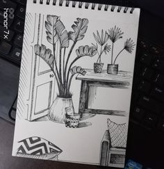 a drawing of some plants on a desk