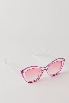 Forever fun and funky, these stand-out sunnies are featured in a classic cat-eye silhouette with color-brimmed, clear frames for an added unique finish. **Features:** Cat eye style, fixed nose pad, ombre tinted lenses **Why We ❤ It:** Just as cool as they are classic, these head-turning sunglasses are sure to be your go-to pick to add a little something extra to every style. | Edie Cat Eye by Free People in Pink Eye Silhouette, Clear Frames, Pink Cat, Cat Eye Sunglasses, Cat Eye, Sunnies, Pink Ladies, Turning, Lenses