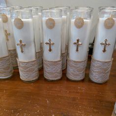 there are many glass cups that have crosses on the inside and lace around them,