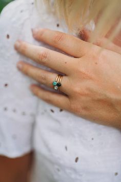 The Tiny Round Gemstone Stacking Ring are sold individually and shown here in turquoise, specularite (black), and mother of pearl.  Can be made with any crushed gemstone of your choice.  Gold plated over pewter with a slightly hammered look.  Sizes 6 and 7 available. Gold Turquoise Ring Birthstone For Gift, Gold Turquoise Birthstone Ring Gift, Stackable Gemstone Rings For May Birthstone, Everyday Stackable Gemstone Rings For May Birthstone, Gold Stackable Turquoise Ring For Anniversary, Gold Turquoise Stackable Ring, Gold Stackable Turquoise Promise Ring, Everyday Stackable Jewelry With May Birthstone, Gold Stackable Rings For Everyday - May Birthstone