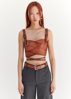 Introducing our Studded Leather Belt, an extra long belt. Style it with this season's Leather Bustier. Tulle Circle Skirt, Mesh Turtleneck, Resort 2024, Leather Bustier, Belt Style, Tomboy Fashion, Studded Leather, Cropped Style, Knit Tanks