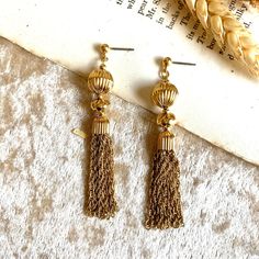 7.5cm #tassel #earrings #vintage #vintageearrings 👀 Please read before purchasing 📏 Check the measurements before buying as each item is different. 🔍 Please note that vintage or secondhand items may have signs of used and small imperfections, feel free to ask more details. 🖤 No return / refunds. Gold Fringe Earrings In Brass, Formal Dangle Tassel Earrings, Vintage Earrings With Latkans For Gift, Elegant Tassel Earrings In Brass, Formal Metal Tassel Drop Earrings, Vintage Gold Brass Danglers, Vintage Earrings With Latkans, Vintage Drop Earrings With Latkans, Gold Tassel Dangle Earrings