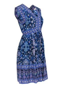 This knee-length dress from Rebecca Taylor is the perfect addition to your wardrobe! In a playful mix of blue, purple, and pink floral prints, it's equally suited for the office or after-work fun. Crafted from luxurious silk, its flattering pattern will have you feeling confident and stylish all day long! Size 2 Shell 100% Silk Lining 100% Polyester V-neckline Sleeveless Fit and flare fit Knee-length Pull-on style Bust 34" Waist 27" Shoulder to hem 38" Blue Printed Knee-length Mini Dress, Blue Floral Print Sundress Sleeveless, Work Fun, Feeling Confident, Fun At Work, Rebecca Taylor, Knee Length Dress, Floral Print Dress, Blue Purple