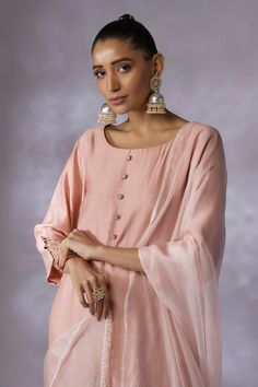 Pink kurta with placement floral embroidery and sequin embellishments. Comes with cut-out hem pant and tasselled dupatta. - Aza Fashions Elegant Chinon Churidar, Designer Wear Blouse Piece For Eid, Raw Silk Sets With Sheer Dupatta, Sheer Dupatta Blouse Piece For Eid, Reception Straight Kurta Sets, Straight Kurta Sets For Reception, Unstitched Cotton Silk Palazzo Set, Slub Silk Sets With Mirror Work And Straight Kurta, Unstitched Salwar Kameez With Mirror Work