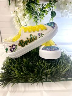 You can pick the colors with these Handmade Bridal Sneakers Mardi Gras-themed. With these colorful decor, festive mask, festival details, and beyond you will look Unique!. After your heels betray you at the wedding, get your bride custom flat shoes and keep dancing. Piece by piece, they are handmade Bedazzled with sequins, rhinestones, glitter, and other beautiful details.🌟Includes🌟- Pick shoelace colors. - The toe top is covered with bright rhinestones.- On the sides of the shoe, the idea/name/date is printed in solid or glitter color.🧡You will receive🧡- One pair of sneaker canvas off-brand- One special custom bag for the shoes🙏Working together🙏- We kindly ask you to please check our size chart to make sure you are ordering the right size. For double check, we will be happy to send Multicolor Sneakers For Spring Party, Multicolor Low-top Party Sneakers, White Party Sneakers For Summer, White Sneakers For Summer Parties, Customizable White Sneakers For Party, Custom Multicolor Low-top Running Sneakers, Bride Flat Shoes, Unique Flat Shoes, Neon Yellow Lace-up Custom Sneakers For Sports