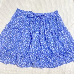 Perfect Condition, Never Worn. Perfect For Any Sort Of Occasion. Not Too Short! Blue Ruffled Skort For Beach, Blue Ruffled Skirt For Summer, Casual Light Blue Ruffled Mini Skirt, Blue Ruffled Summer Skirt, Trendy Blue Tiered Mini Skirt, Trendy Tiered Blue Mini Skirt, Vacation Blue Mini Skirt With Ruffles, Blue Ruffled Mini Skirt For Vacation, Vacation Blue Ruffled Mini Skirt