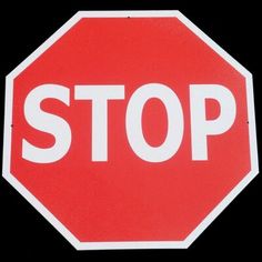 a red stop sign with the word stop written on it's bottom corner in white