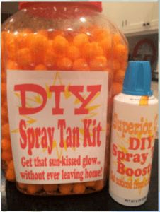 a jar filled with lots of orange balls next to a bottle of diy spray