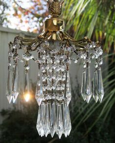 a chandelier hanging from the ceiling outside