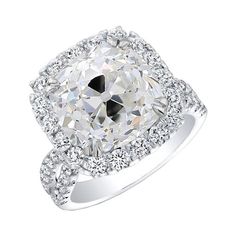 a cushion cut diamond ring with double halos