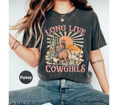 Comfort Colors Long Live Cowgirls Shirt, Western Graphic Tee, Retro Shirt, Rodeo Shirt, Cowgirl Shirt, Western Shirt, Country Girl Shirt WARNING -READ BEFORE ORDERING- REMEMBER: - The design is a Direct-to-Film (DTF) print. -You may refer to the size chart for precise measurements as all our sizes are unisex. There may be differences in sizes among brands. -Feel free to contact us if you have any issues about the things (sizes, shirt colors, design text colors, etc.). -Please be aware that we us Country Girl Shirts, Western Graphic Tees, Rodeo Shirts, Rodeo Fashion, Cowgirl Shirts, Cute N Country, Cow Girl, Loose Shirts, Long Live