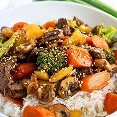 a white bowl filled with rice and vegetables