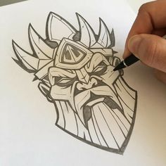 a drawing of a face with a helmet on it's head is being drawn