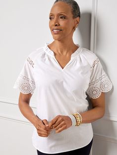 Welcome warmer weather with our oh-so-feminine top. Features pretty ruffles at the neckline with beautiful embroidery at the shoulder and sleeves. Features Popover Short Sleeve Hits At Hip Split Neck Features a curved hem Imported Fit: Misses: 27"; Petite: 25 1/2"; Plus: 29 1/2"; Plus Petite: 28" Material: 100% Cotton Care: Machine Wash Cold; Only Non-Chlorine Bleach When Needed; Tumble Dry Low; Warm Iron, If Needed | Embroidered Sleeve Top - 100% Cotton Talbots White Short Sleeve Tops, Modern Classic Style, Feminine Top, Classic Style Women, Short Sleeve Tops, Beautiful Embroidery, Embroidered Blouse, Top 100, Modern Classic