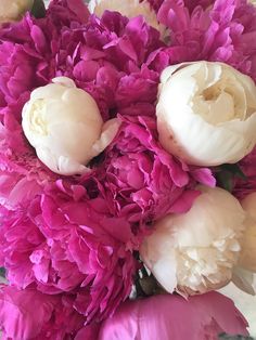 a bouquet of pink and white flowers on a table