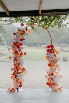 two tall white and orange flowers are on display