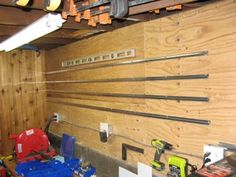 tools are lined up on the wall in this garage