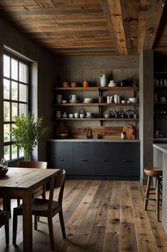 a kitchen with wooden floors and open shelves