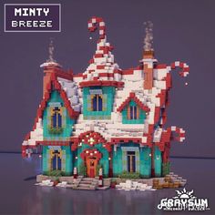 a lego house made to look like it has snow on the roof and chimneys