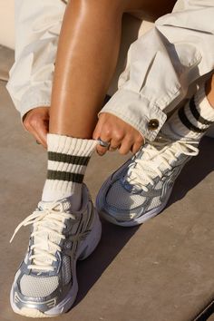 Close up front view of model posing in the crew style ribbed soft moss Mini Stripe Sock Casual Striped Sports Socks, Comfortable Ribbed Casual Socks, Comfortable Casual Ribbed Socks, Casual Ribbed Round Toe Socks, Crew Socks With Sneakers Outfit, Los Angeles Streetwear, Knit Leg Warmers, Joah Brown, Fit Womens