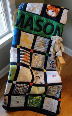 a baby's personalized blanket and teddy bear on a rocking chair