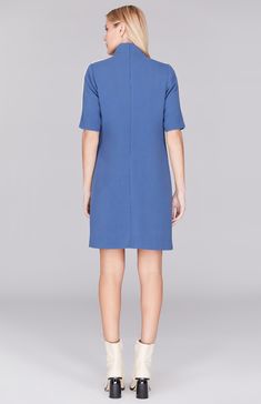 Our signature shift dress, updated with a turtleneck and contrast bias trim. This easy-fit dress features short sleeves with the perfect amount of arm coverage, a simple back zip, and pockets. Wear it along or pair with a coordinating trench coat for maximum impact. Short Sleeve Dress With French Seams For Work, Workwear Dresses With French Seams And Short Sleeves, Blue Knee-length Short Sleeve Work Dress, Charcoal Black, Fit Dress, Charcoal Color, Double Face, Classic Blue, Black Charcoal