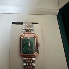 Never Worn Watch. Still In The Case With Box. Emerald Face With Gold & Silver Band. New The Clasp Still Has Protection Covers On It. Elegant Green Watch As A Gift, Elegant Green Watch For Gift, Gold And Silver Watch, Silver Band, Silver Watch, Silver Gold, Emerald, Women Accessories, Band