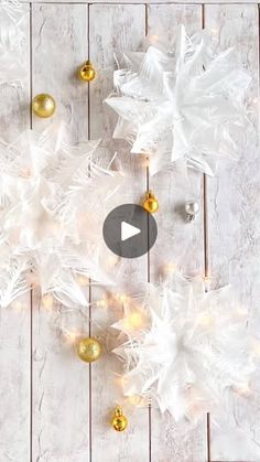 white and gold christmas decorations on a wooden table