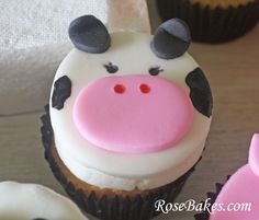 cupcakes decorated with frosting and fondant animals