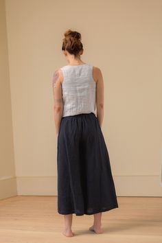 "DETAILS: - 100% linen pant - wide cropped legs - pockets - comfy wide elastic waist - mid-rise - waist is just below belly button LENGTH inseam is 23\" / 58cm from crotch point. MODEL is 5'3\" tall with B 32, W 28, H 35 wearing a size X-Small. Pictured above in mid-weight Midnight color. Select colors and sizes available Ready to Ship https://www.etsy.com/listing/983888219/small-batch-ready-to-ship-fog-culotte FABRIC: - The mid weight linen is 5.3oz / 150g. It is very soft and has a a nice line Relaxed Fit Linen Cropped Bottoms, Relaxed Fit Cropped Linen Bottoms, Summer Cropped Bottoms With Loosely Fitted Hips, Linen Wide Leg Cropped Pants With Elastic Waistband, Wide Leg Ramie Bottoms With Pockets, Effortless Linen Ankle-length Bottoms, Relaxed Fit Linen Wide-leg Culottes, Relaxed Fit Linen Ankle-length Culottes, Relaxed Fit Linen Culottes With Wide Legs