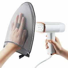 a person is using a hair dryer to dry their hands