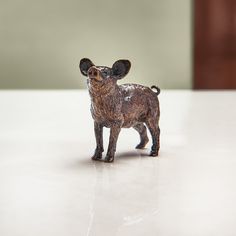 a small figurine of a mouse on a table