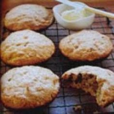 several cookies cooling on a rack with a spoon