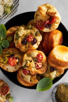 a bowl filled with different types of pastries on top of a white countertop