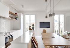 the kitchen is clean and ready to be used for dinner or lunchtime, with plenty of natural light coming in