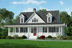 a white house with black shingles and red door