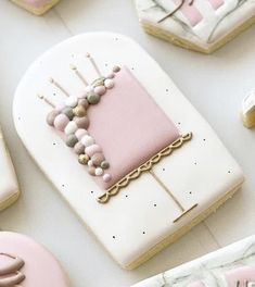 decorated cookies are arranged on a table