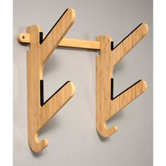 two wooden hooks hang on the wall