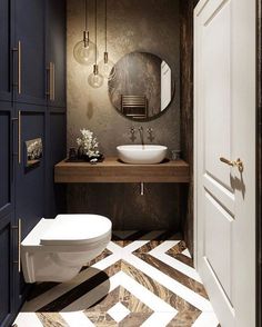 a bathroom with a white toilet sitting next to a sink and a mirror on the wall