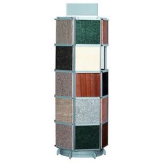 a tall display case with different colored tiles on it