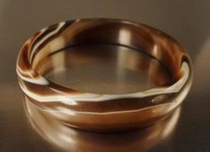 A beautiful handcrafted vintage bangle bracelet round brown and beige striations carnelian agate all around as you can see from the pictures. It is in great vintage condition without any problems and has a 3 inches diameter opening and is 1/2 Inch wide on it's concave top.. A beautiful handcrafted heirloom, one of a kind brown and beige striations agate bracelet, you will enjoy wearing ! Handmade Brown Round Bangle, Vintage Bangle Bracelets, Carnelian Agate, Vintage Bangles, Brown And Beige, Agate Bracelet, Chicago Il, Bangle Bracelet, Bangle Bracelets