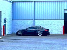 a black car parked in front of a building