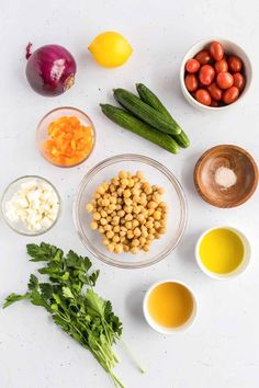 ingredients to make chickpeas salad laid out on a white surface